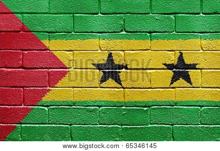 Flag of Sao Tome and Principe painted onto a grunge brick wall