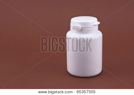 White box with chewing gum on the brown background