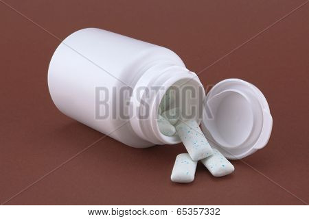 White box with chewing gum on the brown background