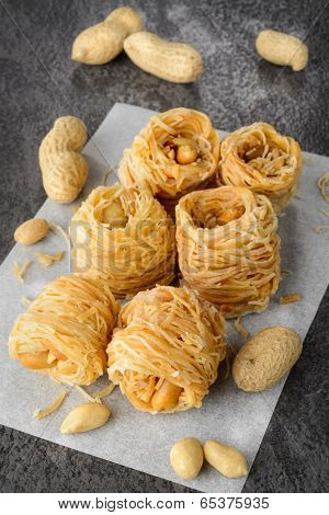Closeup of birds nest baklava dessert with peanuts