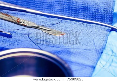 Surgical Concept. Bloody Scalpel.