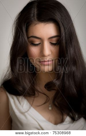 Beautiful Young Brunette Woman Looking Down