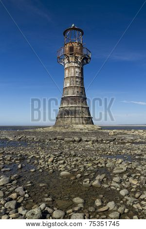 Ruined Derelict Lighthouse, Whiteford Sands, Gower Peninsula, South Wales. Blue Sky.