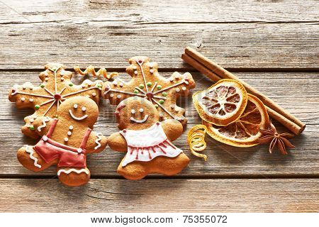 Christmas homemade gingerbread couple cookies on wooden table
