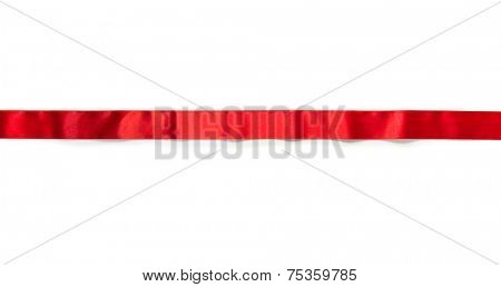 Extending simple red ribbon with typical ripples or wrinkles of a silky or satin ribbon , isolated on white. 