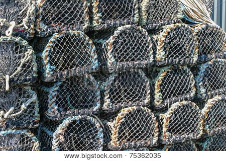 Lobster Pots Stacked On The Quay In Padstow, Cornwall, England Uk