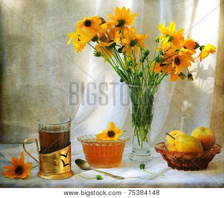 Still-life with juicy fresh pears both fragrant honey and fresh tea and a bright bouquet