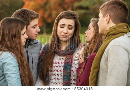 Friends Comforting Crying Girl
