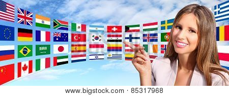 smiling woman shows international flags