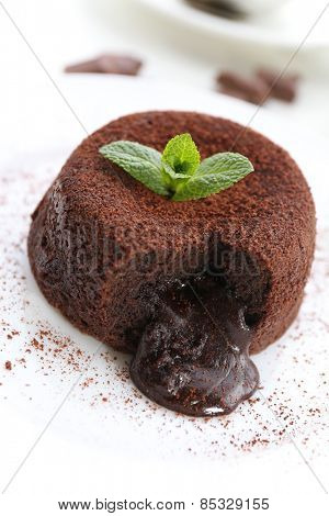 Hot chocolate pudding with fondant centre on plate, close-up