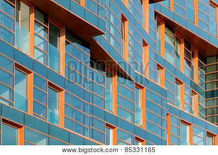 Modern building mirror facade in blue tone