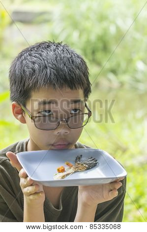Pensive Boy Looks At Fish Bone Eaten Clearly On Plate