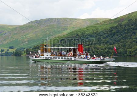 Warm calm summer weather on Monday 30th June 2014 brought visitors to Ullswater Lake District, to ta