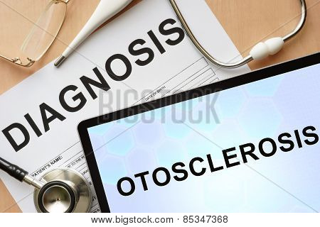 Tablet with diagnosis  otosclerosis and stethoscope.