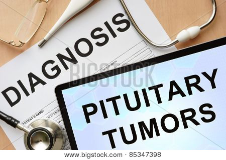 Tablet with diagnosis pituitary tumors and stethoscope.