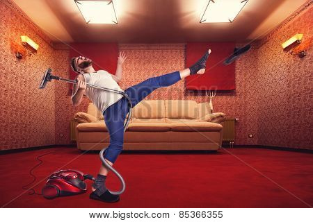Adult man dancing with vacuum cleaner 