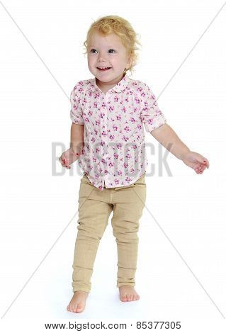 pretty little girl goes barefoot on the floor