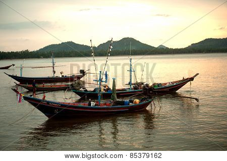 Traditional Fishing Long Tailed Boat In Koh Phitak Island, Thailand At Sunset.