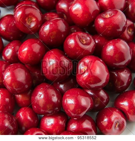Bowl Of Red Fresh Cerries On A White Background