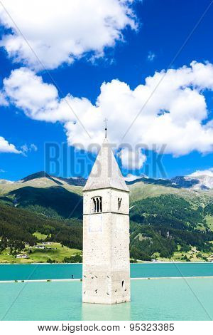 tower of sunken church in Resia lake, South Tyrol, Italy