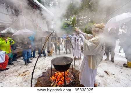 NAGANO, JAPAN - FEB 4, 2013: Shinto Ascetics perform ancient purifying rites. Known as Yamabushi, they are mountain hermits with a long tradition of mysticism.