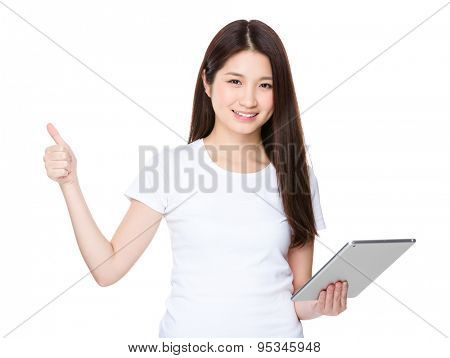 Asian young woman hold with tablat and thumb up