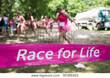 SOUTHAMPTON, UK - JULY 4 : Women gather for the annual Race for Life Pretty Muddy fun run, to raise money for Cancer Research. 4 July 2015 in Southampton, UK.