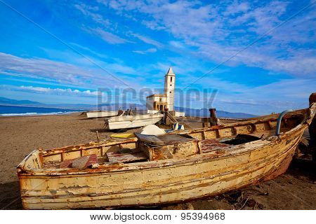 Cabo de Gata in Almeria at San Miguel Beach and Salinas church with stranded boats