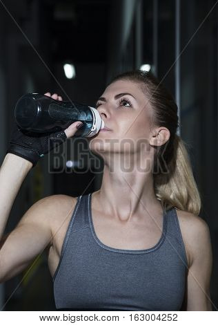 Young Woman Goes In For Sports At Gym