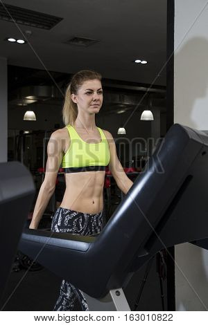 Young Woman Goes In For Sports At Gym