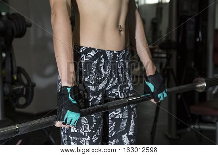 Young Woman Goes In For Sports At Gym