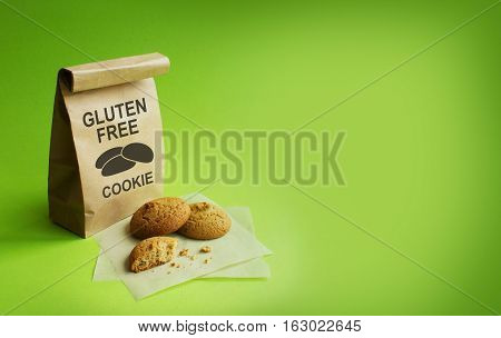 Gluten-free cookies in the kraft bag. Green background. NO Gluten