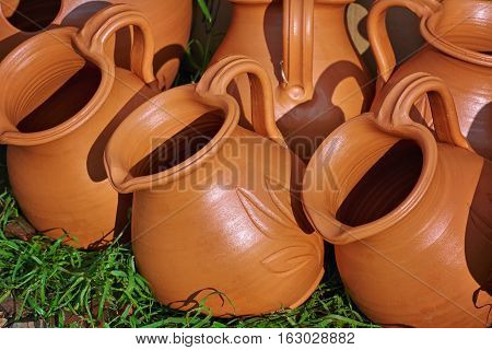 Image of Row of Pitchers on the Grass