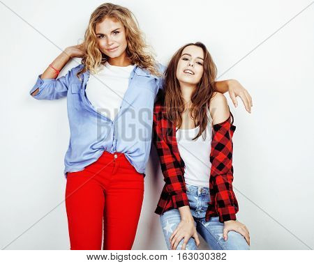two best friends teenage girls together having fun, posing emotional on white background, besties happy smiling, making selfie, lifestyle people concept close up