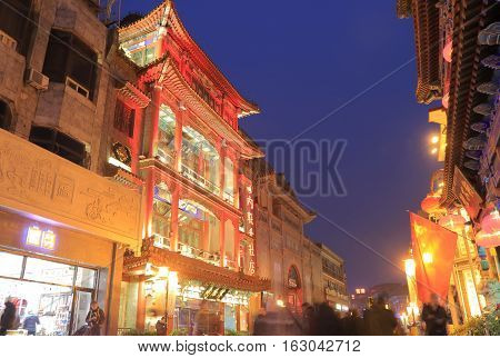 BEIJING CHINA - OCTOBER 24, 2016: Unidentified people visit Beijing Hutong street. Hutongs are a type of narrow streets or alleys, commonly associated with northern Chinese cities.