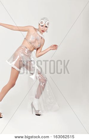 Girl Tries To Find A Way Out. She Is Dressed In An Unnatural Clothes