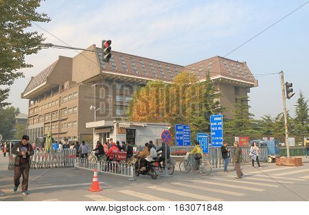 BEIJING CHINA - OCTOBER 25, 2016: Unidentified people visit Peking University. Peking University is the first modern national university established in 1898 in China