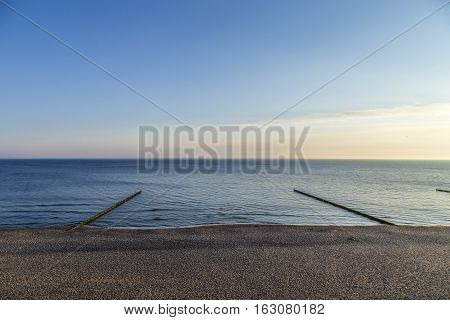 Beach Landscape With Wooden Wave Breakers