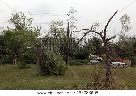 In the next morning after a serious storm. Broken trees, cars, furniture.