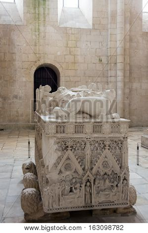 ALCOBACA, PORTUGAL - OCTOBER 16, 2015: The tomb of king Pedro I in the Alcobaca Monastery a Mediaeval Roman Catholic monastery located in the town of Alcobaca Portugal
