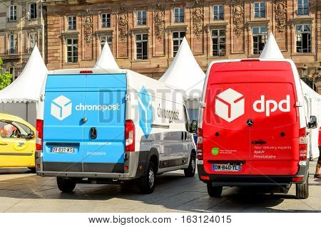 STRASBOURG; FRANCE - JUN 24; 2016: CHRONOPOST DPD and La Poste delivery vans in center of the city. Chronopost and DPD is part of French group La poste