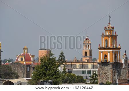 View of the city of Cholula from the top of a pyramid. The city has over 365 church so no matter where you look you will see one or more. Puebla, Mexico