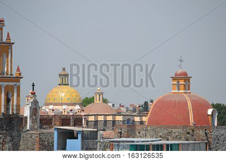 View of the city of Cholula from the top of a pyramid. The city has over 365 church so no matter where you look you will see one or more. Puebla, Mexico