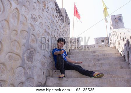 Asia man With Great Wall Of China model at Santichon village Chinese style village