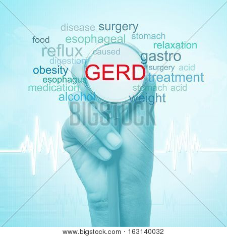 hand holding stethoscope with GERD word. medical concept