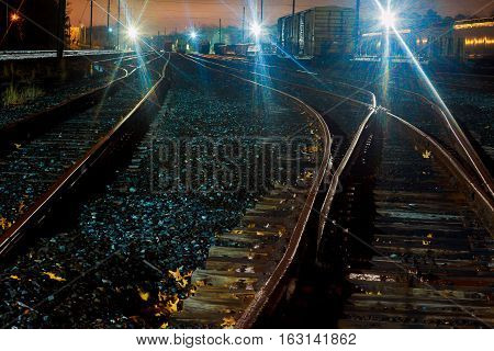 Cargo train platform at night. Railroad in Ukraine. Railway station. railway station wagons night