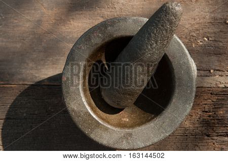 old granite stone mortar and pestle are Thai cooking tool