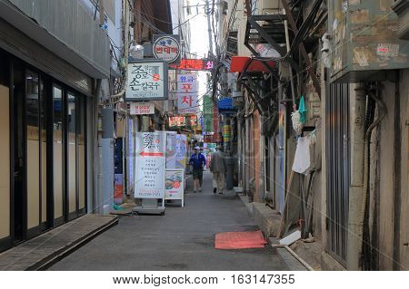 SEOUL SOUTH KOREA - OCTOBER 20, 2016: Bars and restaurant on narrow alley street in Insadong Seoul downtown.