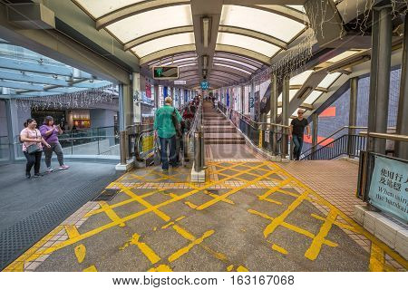 Hong Kong, China - December 4, 2016: the beginning of popular Mid-Levels escalator and walkway system on Queen's Road Central in Hong Kong, the longest outdoor covered escalator system in the world.