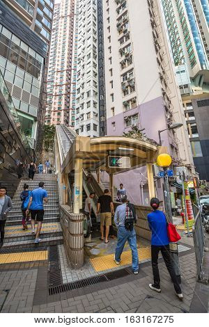 Hong Kong, China - December 4, 2016: The final section of Central-Mid-levels escalator, runs from Mosque Street, and is linked by footbridge over Robinson Road and walkways up to end in Conduit Road.
